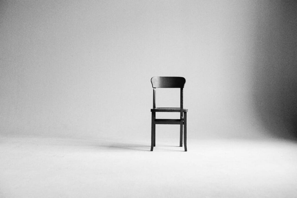green chair in an empty photography studio